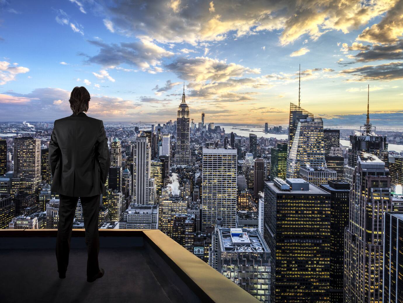 Man watching the city on the rooftop